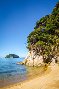 Scenic view of sea against clear blue sky