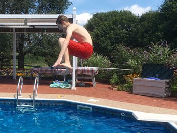 Side view of a girl playing in water
