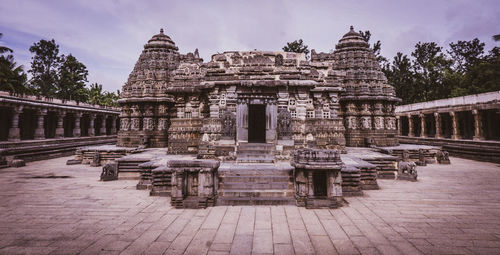 Old temple building against sky