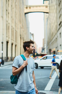 Young man walking in city