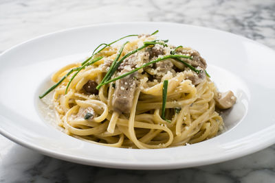 High angle view of noodles in plate on table