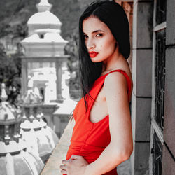 Portrait of a beautiful young woman standing outdoors