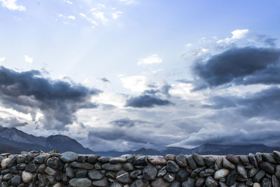 Low angle view of rocks against sky