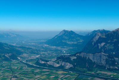 Scenic view of mountains against clear blue sky