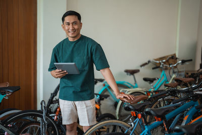 Portrait of young man riding bicycle