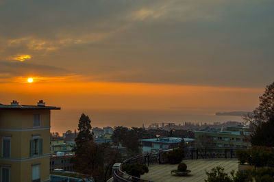 High angle view of buildings against sky during sunset