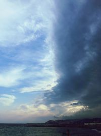 Scenic view of sea against storm clouds