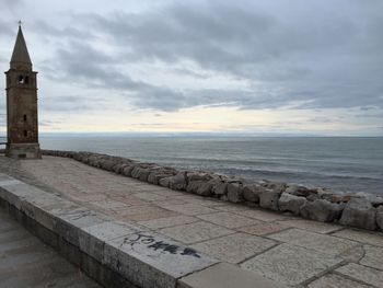 Scenic view of sea against cloudy sky