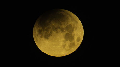 Low angle view of half moon against sky at night