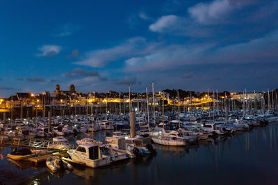 Boats moored at harbor