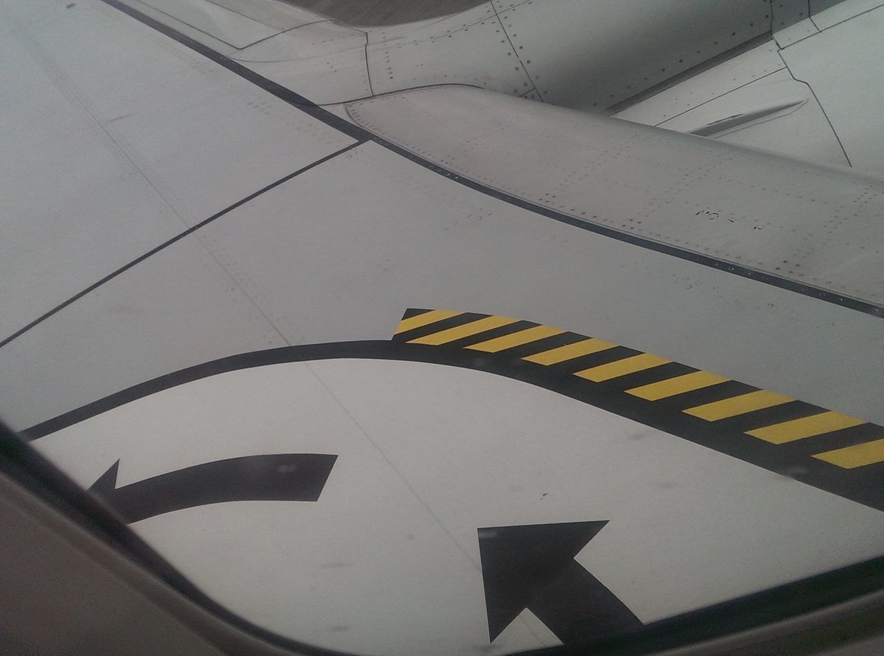 LOW ANGLE VIEW OF AIRPLANE AGAINST SKY