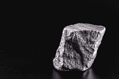 Close-up of rock against black background