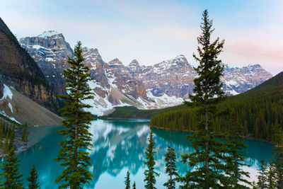 Scenic view of mountains and lake against sky during winter