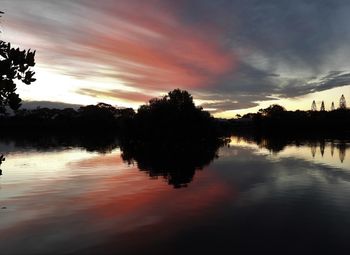 Scenic view of lake against sky during sunset