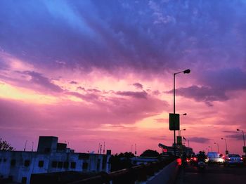 Road against cloudy sky at sunset