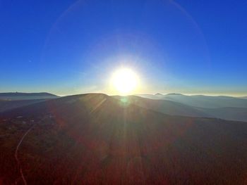 Sun shining over landscape