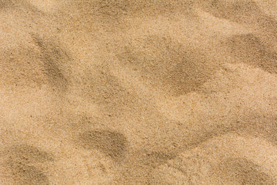 Full frame shot of paper on sand