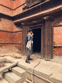 Full length of woman standing at bhaktapur