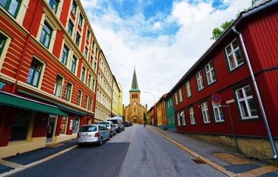 Street amidst buildings against sky