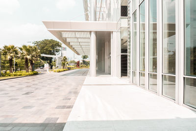 Footpath amidst buildings in city