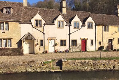 Woman by houses in town