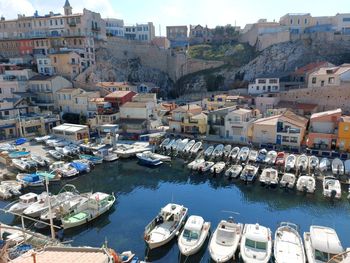 Boats moored at harbor