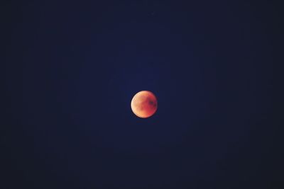 Low angle view of moon against sky at night