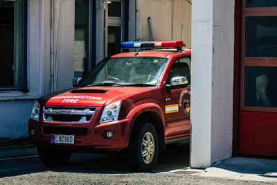 Car parked on street against buildings