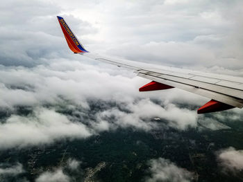 Low angle view of airplane flying in sky