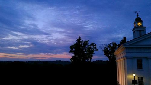 Low angle view of silhouette trees against sky at sunset