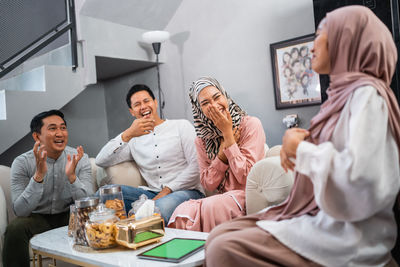 Friends sitting on table