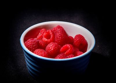 High angle view of strawberries in bowl on table