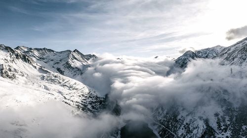 Scenic view of snowcapped mountains against sky