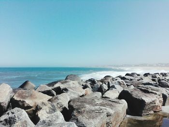 Scenic view of sea against clear blue sky