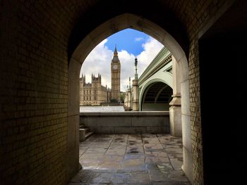 View of historic buildings seen through arch