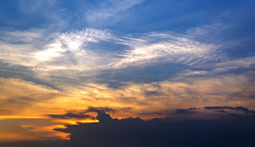 Low angle view of cloudy sky during sunset