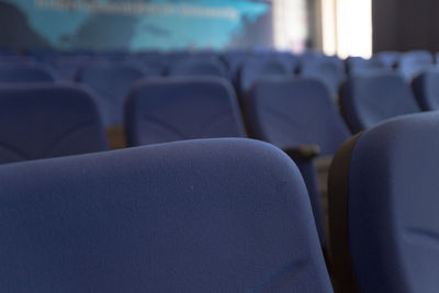 Close-up of empty chairs in stadium