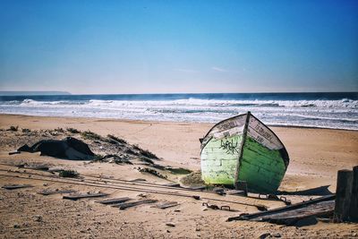 Scenic view of beach against clear sky