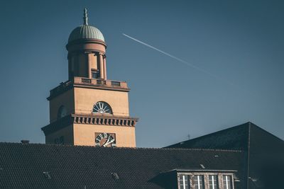 Low angle view of tower against blue sky