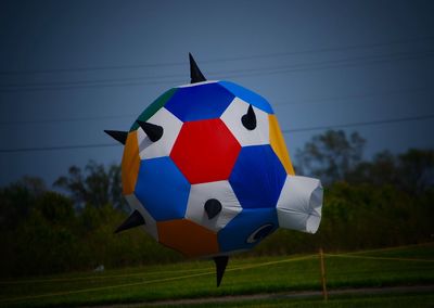 Colorful balloon in mid-air against clear sky