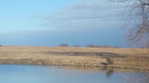 Scenic view of calm sea against sky