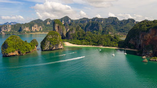 Amazing thailand high season beautiful seascape aerial view ao nang beach island and long tail boat 