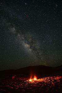 Scenic view of star field against sky at night