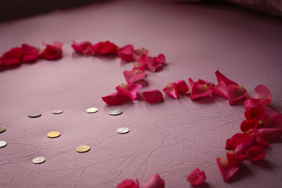 Close-up of pink roses on table