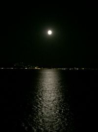 Scenic shot of moon over calm lake