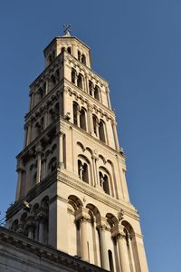 Low angle view of a building against clear blue sky