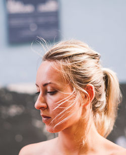 Close-up of thoughtful young woman standing outdoors