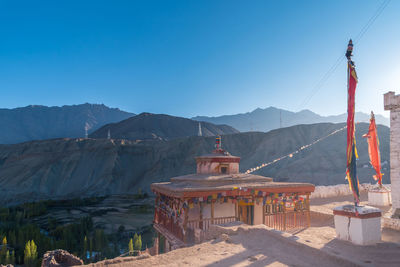 View of mountain range against blue sky