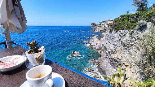 Scenic view of sea against mountain