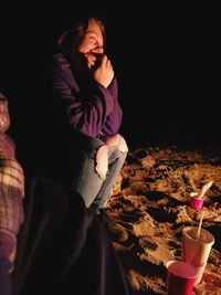 Young women vibing under the night sky